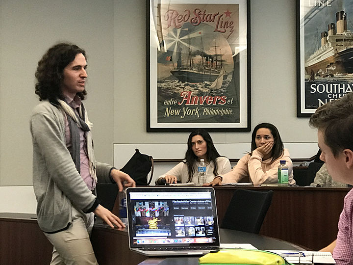 The class listens to a lecture indoors during their Tribeca trip.