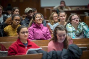 Students in the audience listen as Laila Lalami, author of this year's Community Reading, Hope and Other Dangerous Pursuits, hugs a student at Colton Chapel.