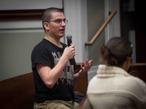 A student in the audience asks a question as Laila Lalami, author of this year's Community Reading, Hope and Other Dangerous Pursuits, speaks at Colton Chapel.