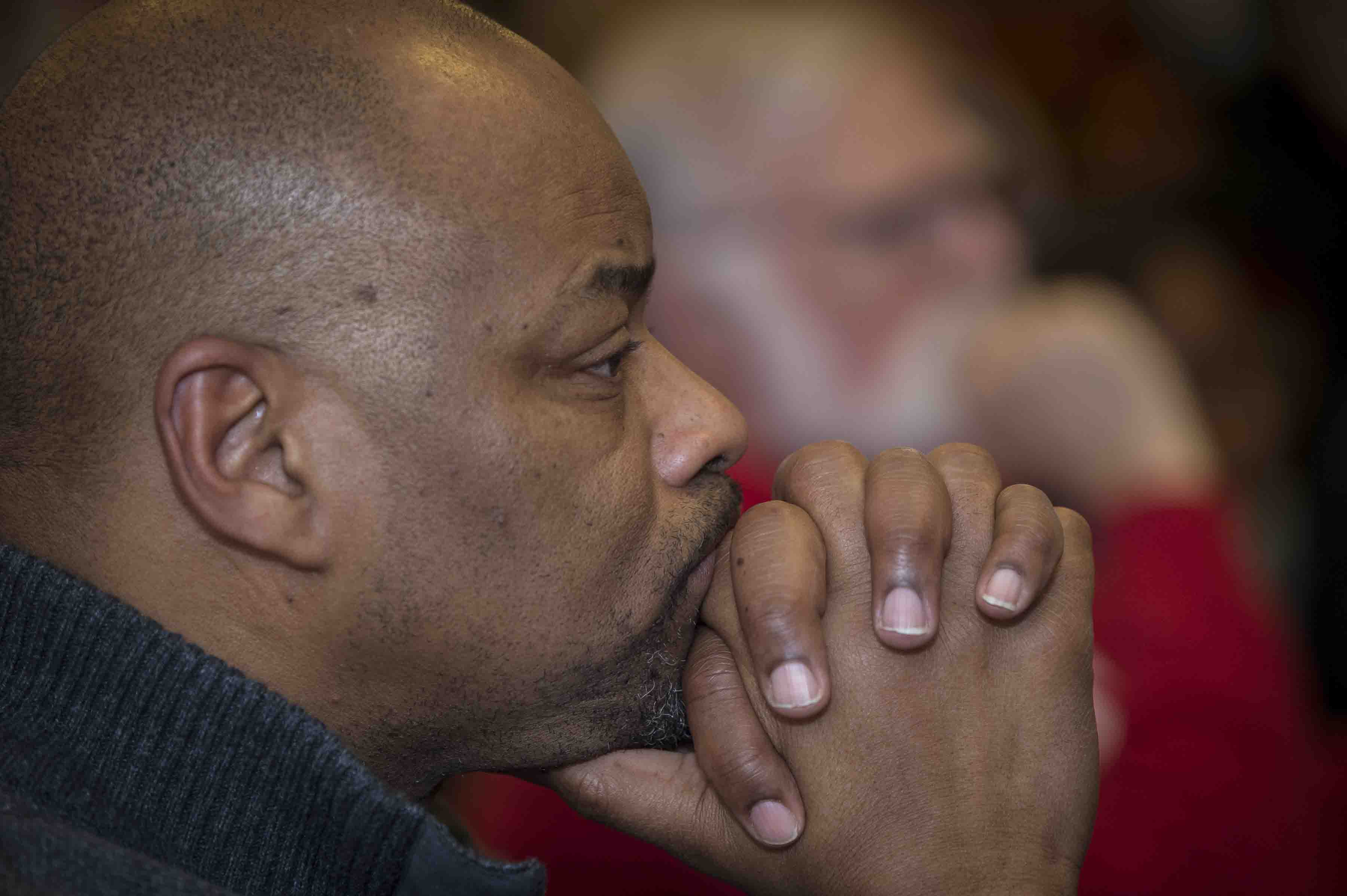A man listens to Kevin Young's lecture on fake news