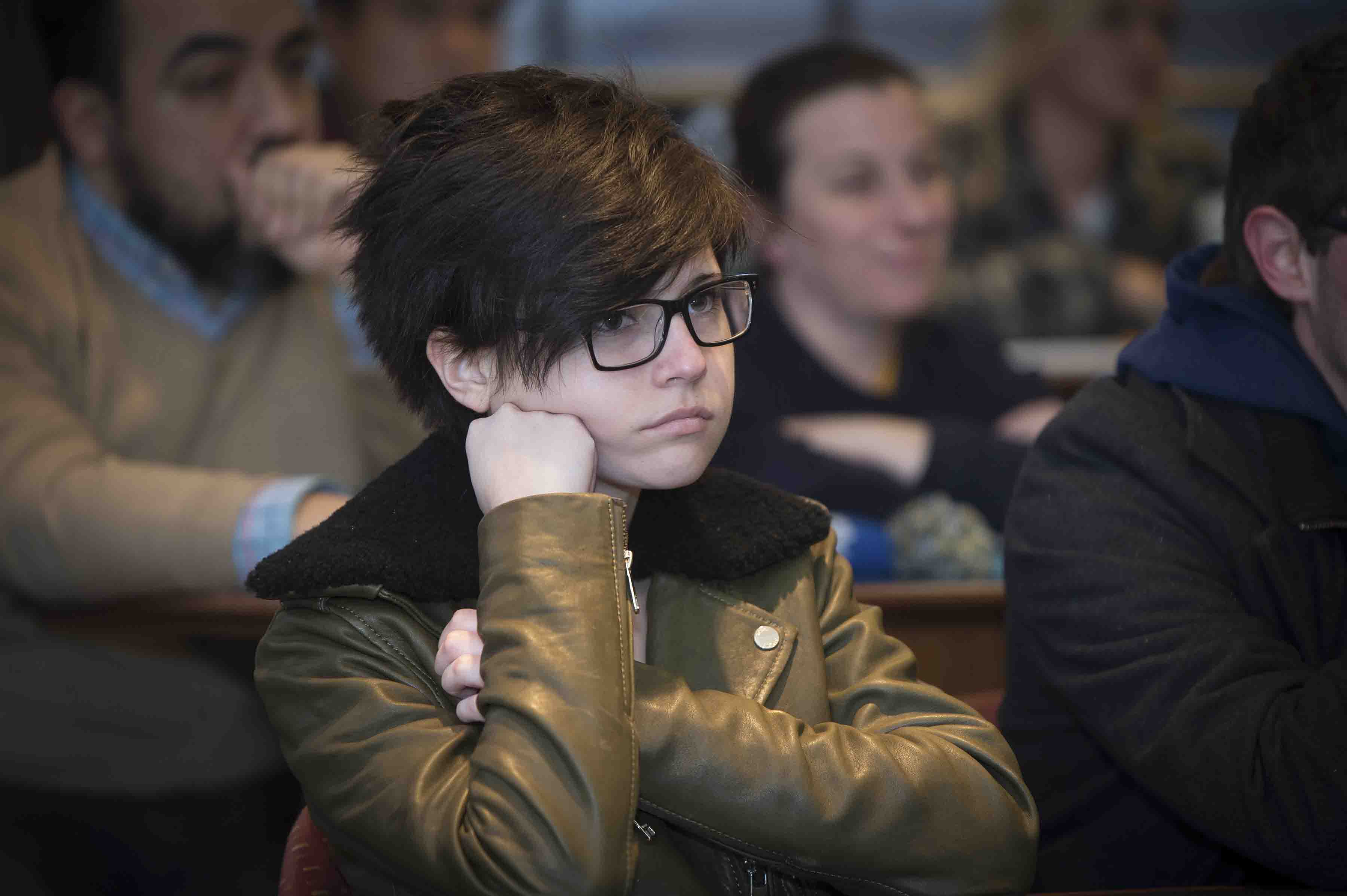 A student listens to Kevin Young's lecture on fake news.