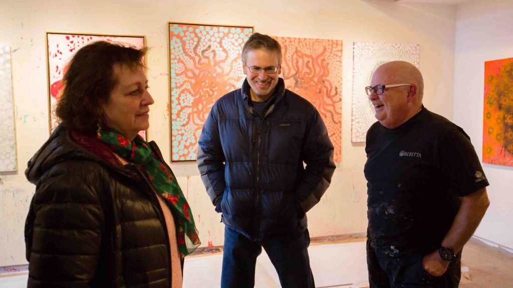 Ed Kerns laughs with biology faculty.