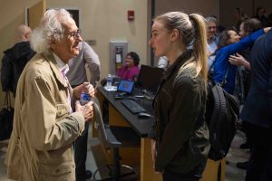 World-famous environmental artist Christo speaks with a student after giving the 2018 Grossman Visiting Artist lecture.