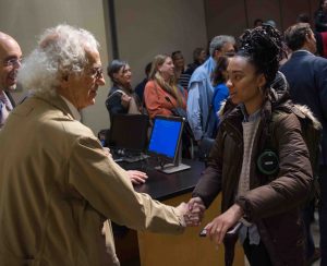 World-famous environmental artist Christo shakes hands with a student after giving the 2018 Grossman Visiting Artist lecture.