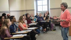 Pioneering feminist, activist and author Rita Mae Brown talks with students in class.