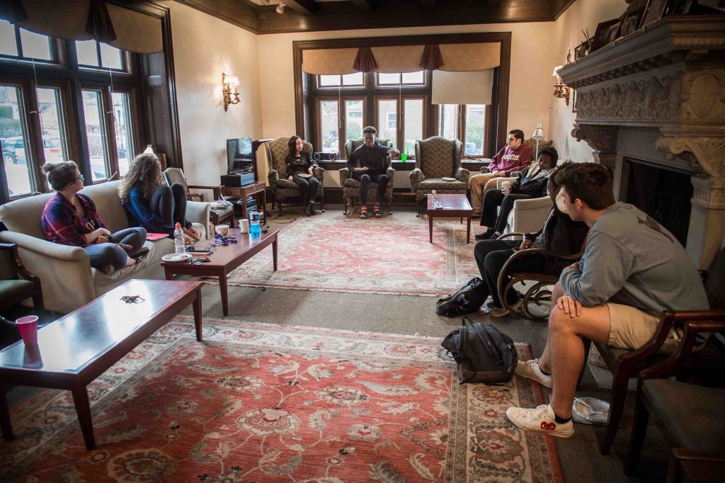 Students take part in the McKelvy House dinner and discussion.
