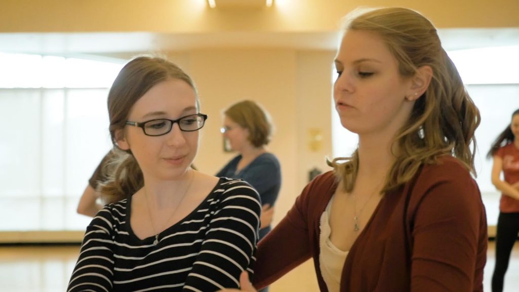 Andrea Killian '19 teaches a fellow student to swing dance.