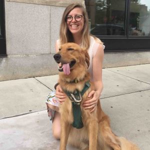 Erin Cottle Hunt holds Aggie, her two-year-old golden retriever.