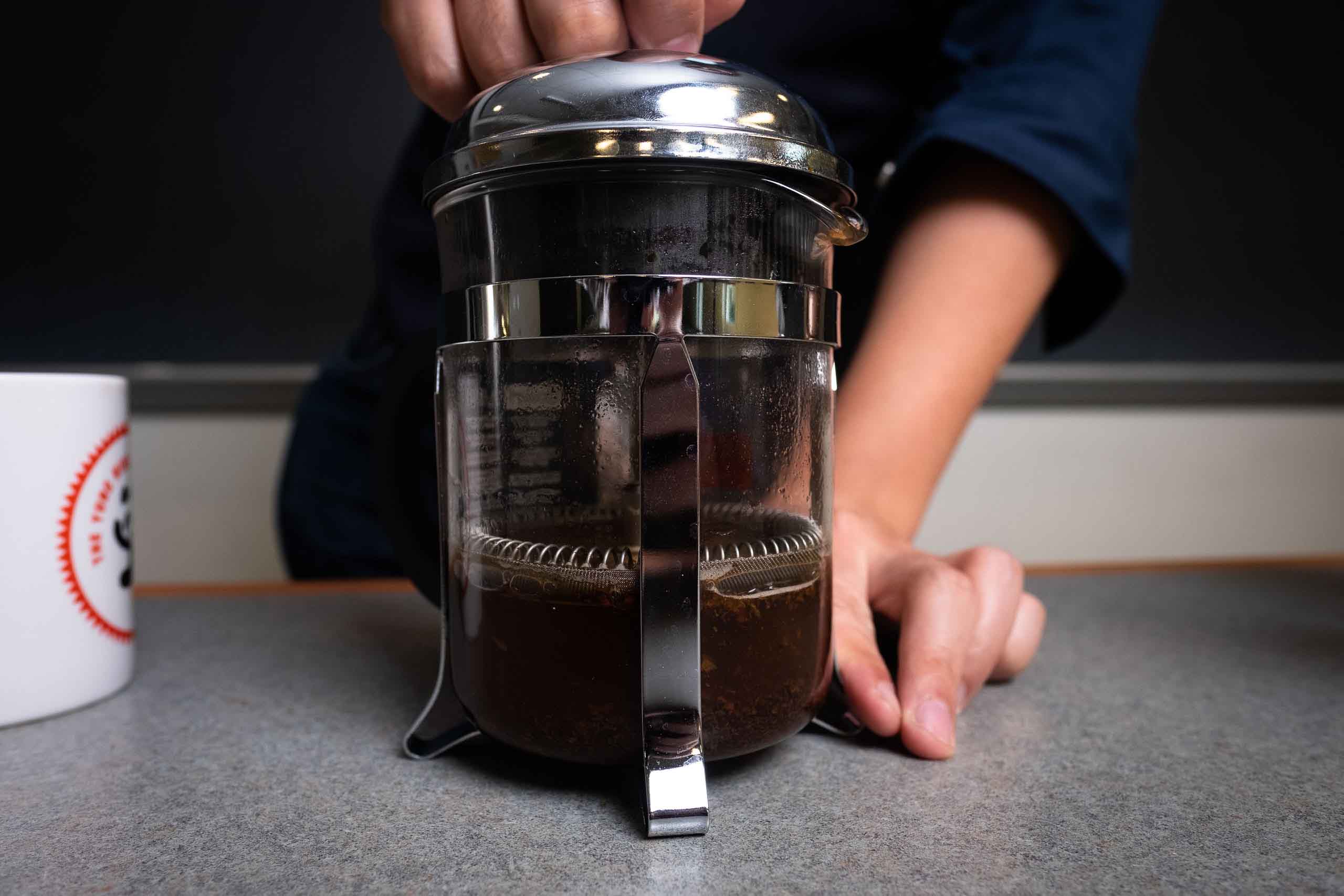 A French press with coffee inside