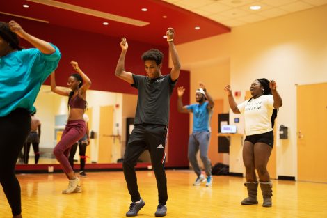 Students dance in a free class at Kirby Sports Center.