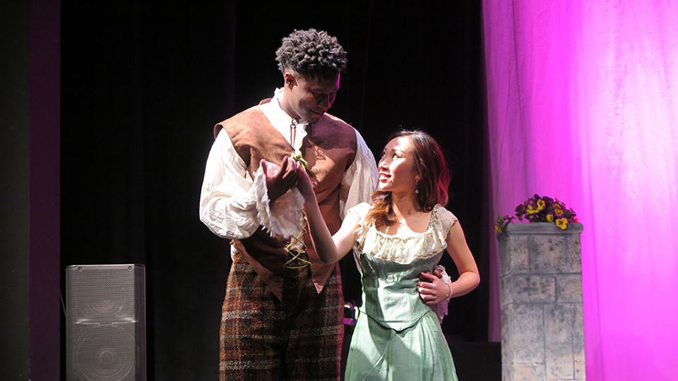 Michael Anekwe performs in a play with a female student.
