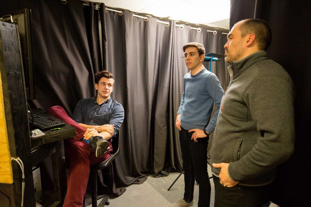 The autonmous vehicle research team has a discussion.