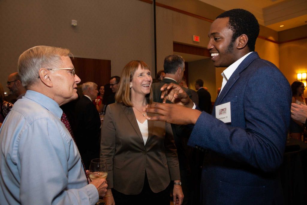 Dave Veshosky, associate professor of civil and environmental engineering, Lafayette President Alison Byerly, and Saeed Malami '20 talk at the reception honoring Bradbury Dyer III '64.