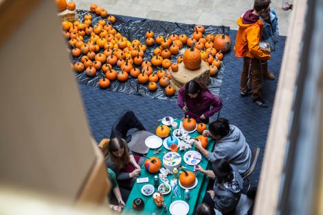 Students paint pumpkins in the Farinon Center during the annual Fall Fest.
