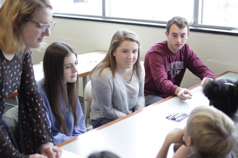 Lafayette students from the First-Year Seminar Happiness class interact with school children.