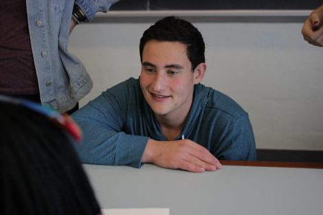 School children use magic markers during the session led by Lafayette College students in the Happiness First-Year Seminar.