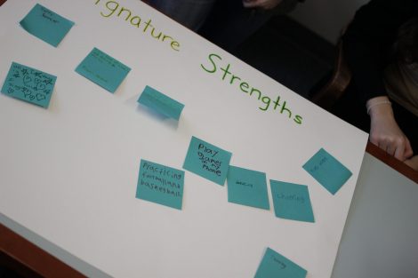School children write on Post-It Notes during the class section led by Lafayette's Happiness First-Year Seminar.