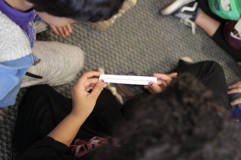 Lafayette students from the First-Year Seminar Happiness class interact with school children.