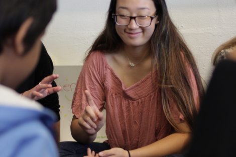 A Lafayette student plays jenga with school children.