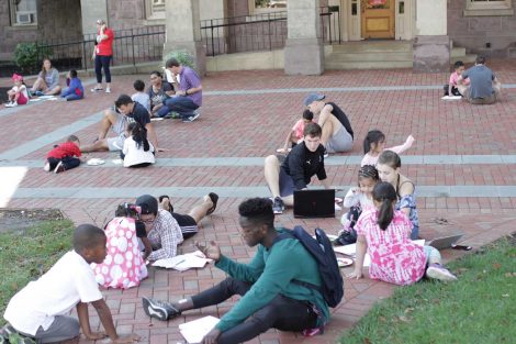 Lafayette College students teach Cheston Elementary School third-grader about math by using Skittles during a Center for Community Engagement program.