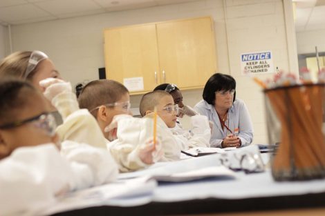 Students listen to their college student instructors.