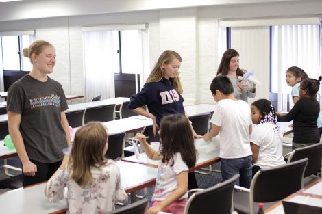 Lafayette students observe the students shaking their ice cream bags.