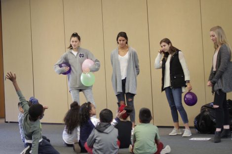 Lafayette students explain how to work together to keep balloons in the air.