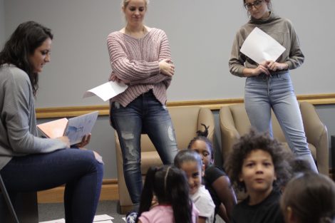 Elementary students laugh and react to Lafayette students.
