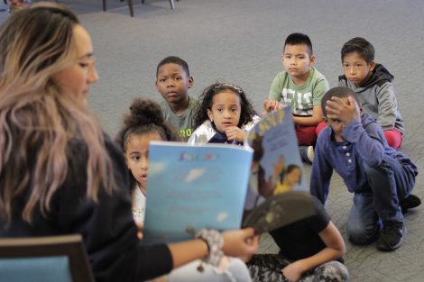 Elementary students listen to Stone Soup.