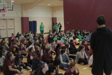 Fifth graders listen to Lafayette athletes.