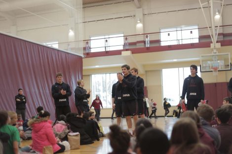 Lafayette athletes teach the fifth graders some cheers to use during the game.