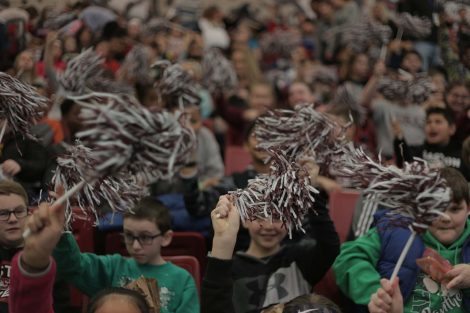 Students shake their pom poms