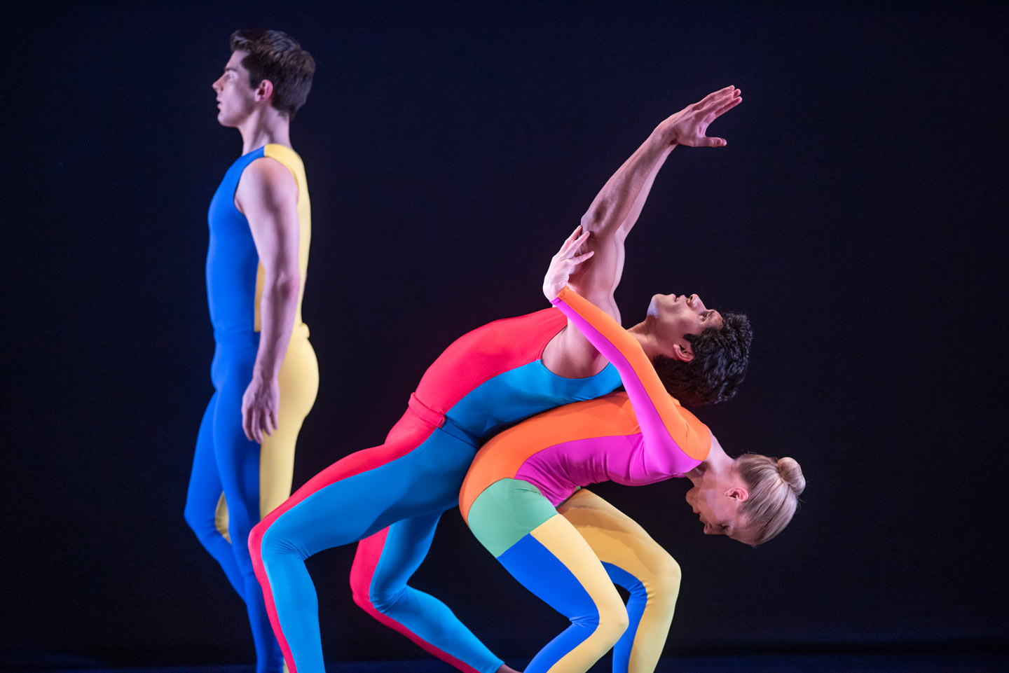 Three Taylor 2 Dance dancers with colorful outfits perform on stage at Lafayette College's Williams Center for the Arts.