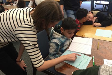 A Lafayette College student helps a Cheston Elementary School student with his work.