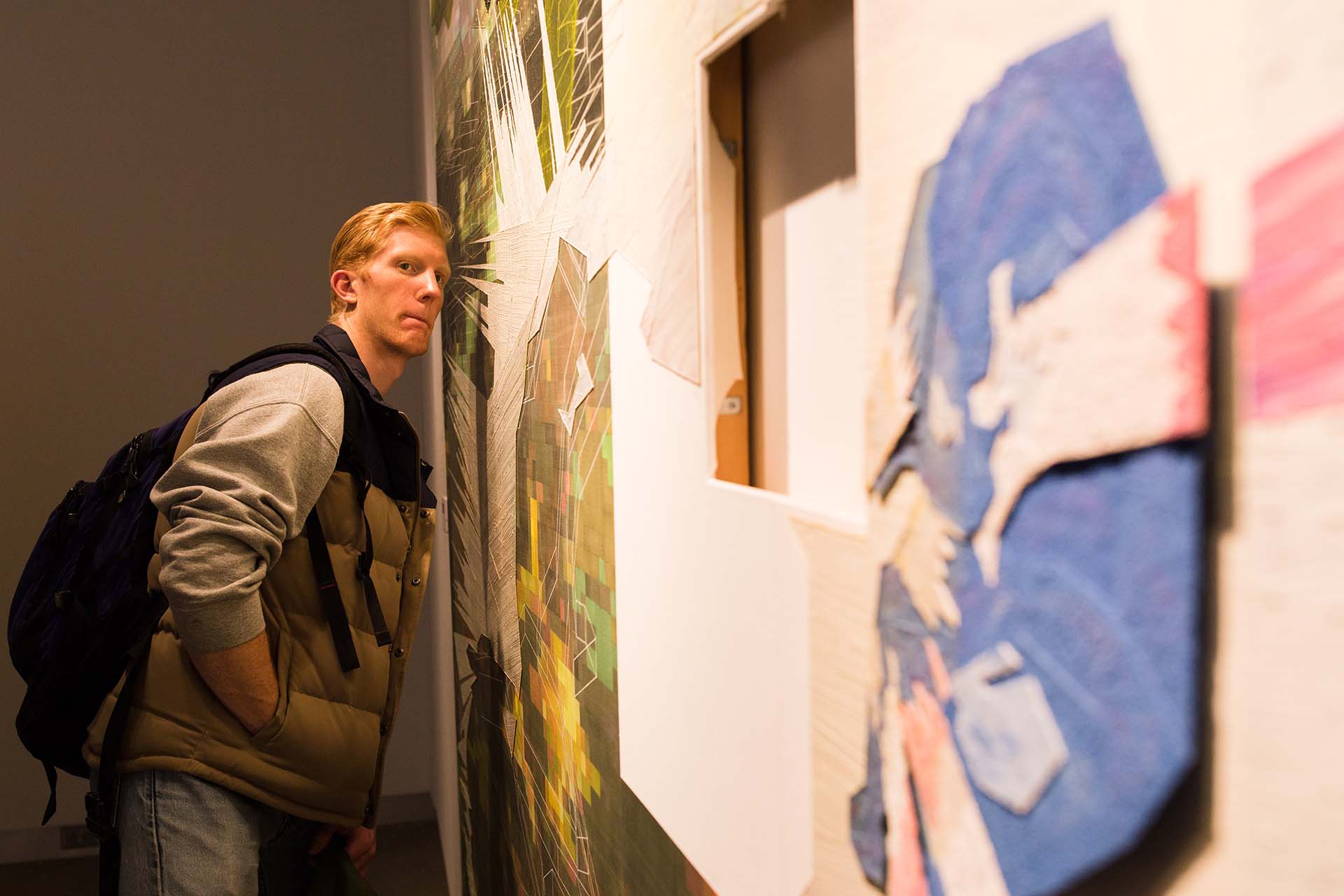 Student looks through window in painting.