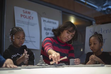 A Lafayette student helps model some clay.