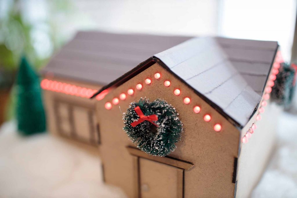 A house model with LED lights built into the walls.