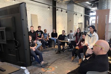 Taney Rongier speaks with students