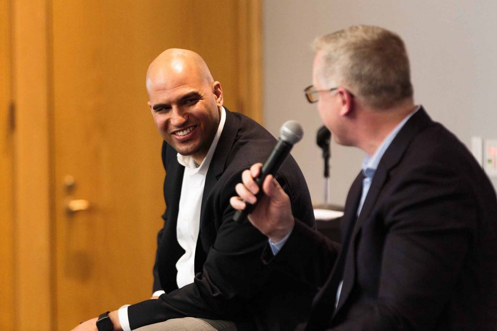 Dyer Center Director Yusuf Dahl laughs as Bill Wagner '89 speaks.