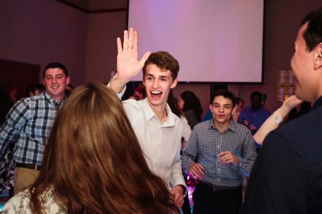 A student gives a high-five at the annual President's Ball.