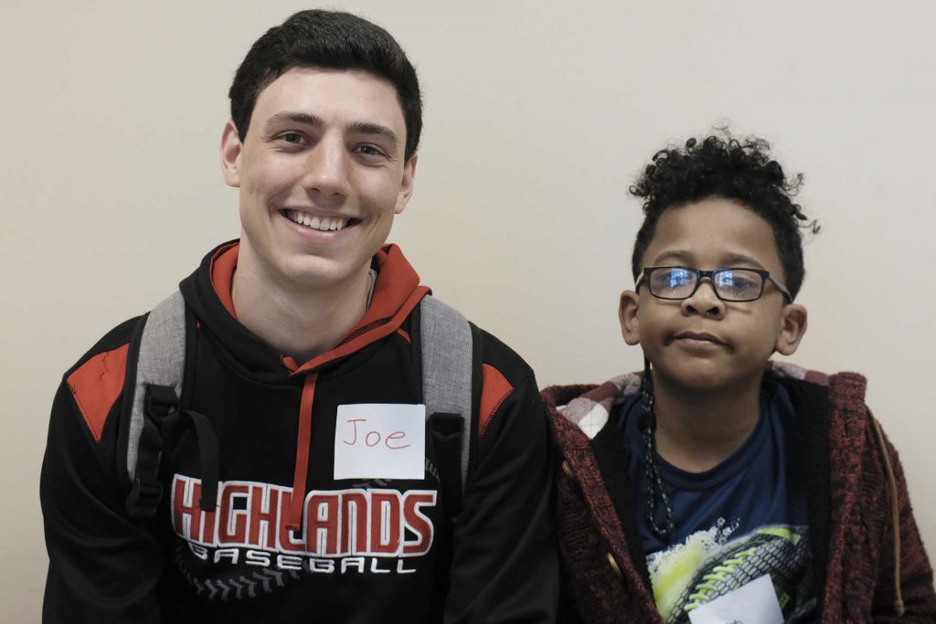 Jaylen sits next to his pen pal Joe