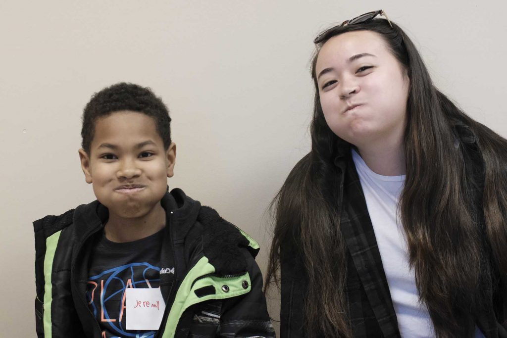 Jeremy sits next to his pen pal Kaitlin