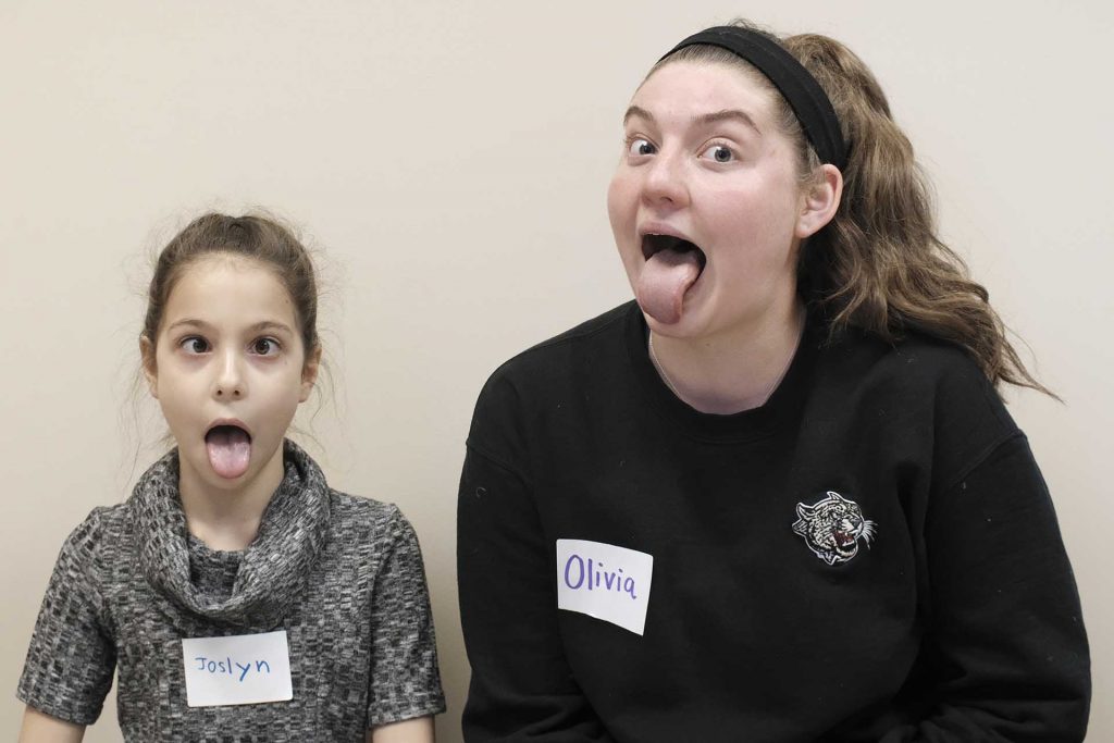 Joslyn sits next to her pen pal Olivia