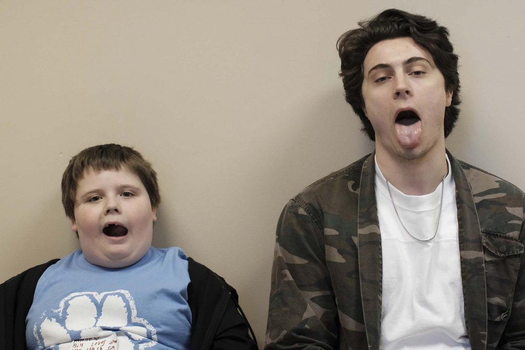 Matthew sits next to his pen pal Ted
