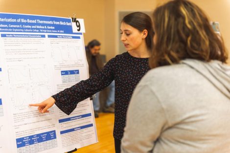 Students explain their research to visitors at the 2019 spring poster session in Kamine Gymnasium in Kirby Sports Center.