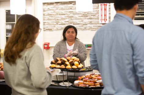 Students chow down on breakfast food late at night, served up by faculty and staff.