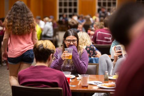 Students chow down on breakfast food late at night, served up by faculty and staff.