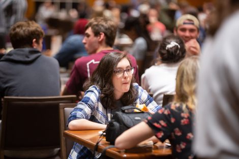 Students chow down on breakfast food late at night, served up by faculty and staff.