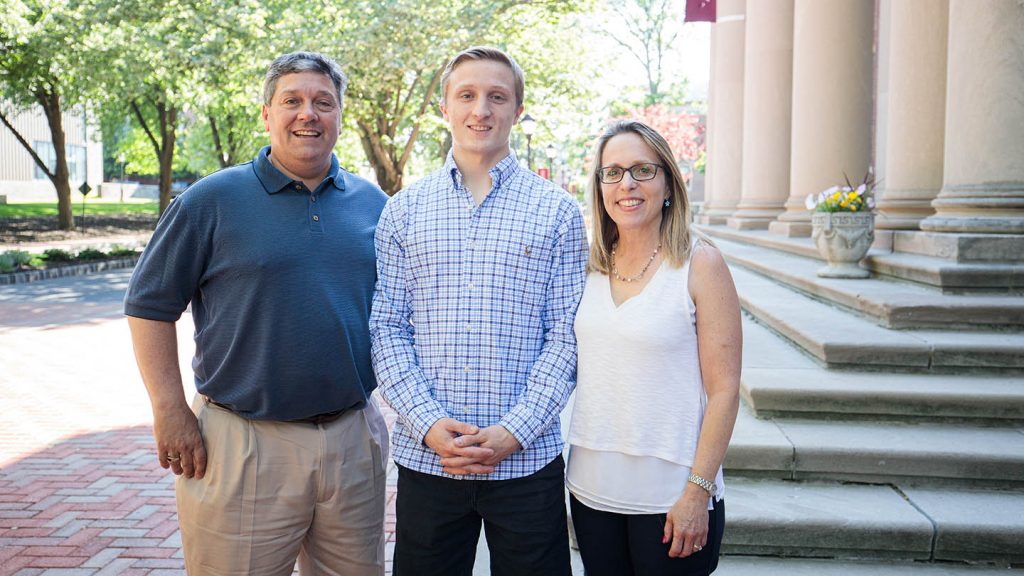 Scholarship winner Christian Combi with his parents Cynthia and Mark.