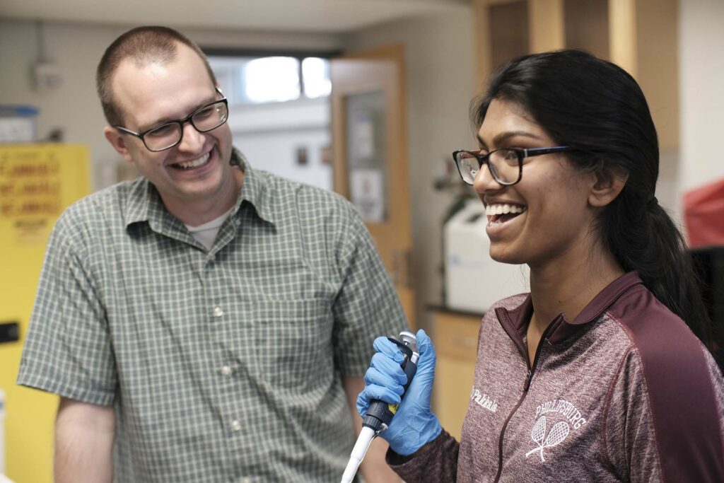 High school student Trisha Pakkala shares a laugh with Prof. Van Horn